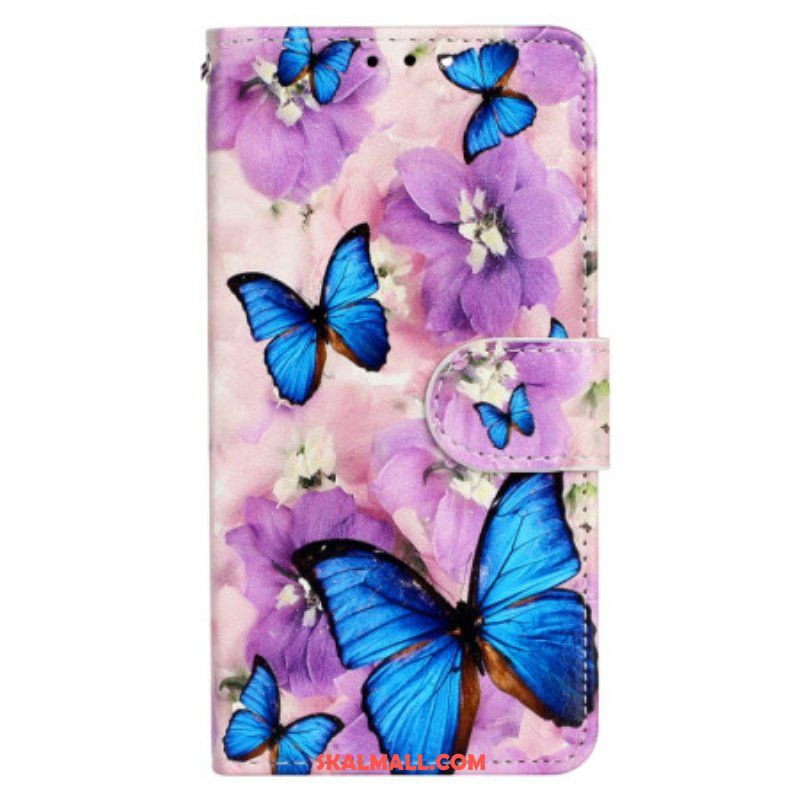 Fodral iPhone 15 Med Kedjar Små Blå Fjärilar Med Rem